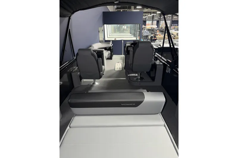 Slide: The Image of 2026 Veranda RELAX VR235VLI boat interior with seating and helm, showcasing modern design. - 10