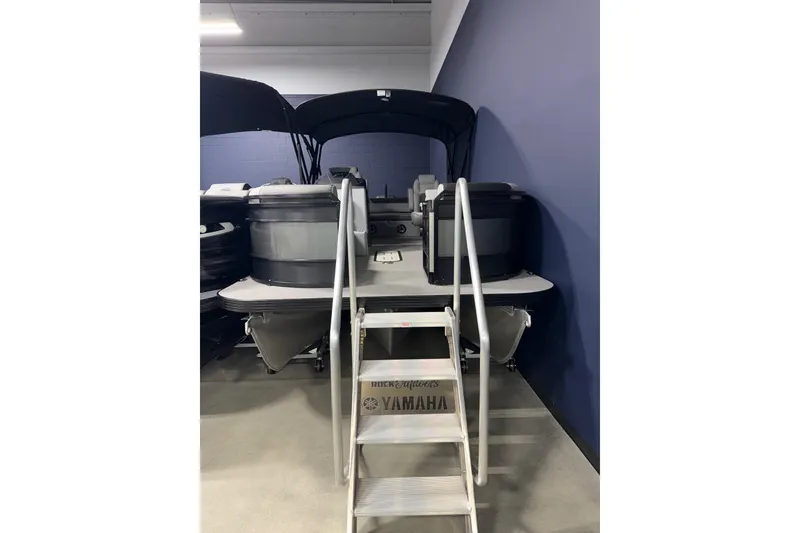 Slide: The Image of 2026 Veranda RELAX VR235VLI pontoon boat with ladder, displayed indoors. - 6