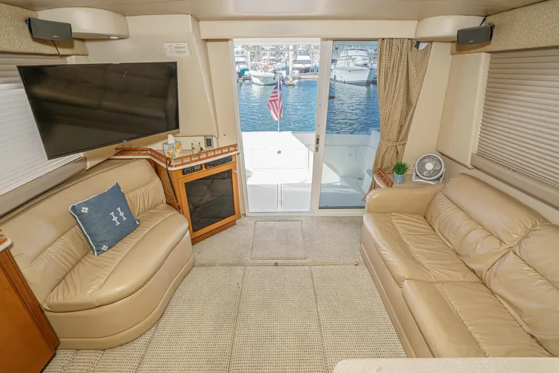Slide: The Image of Interior of 2005 Meridian 381 Sedan yacht with leather seating and waterfront view. - 13