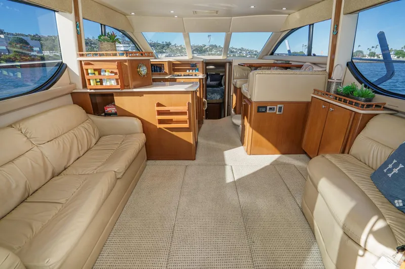 Slide: The Image of Luxurious interior of 2005 Meridian 381 Sedan yacht with plush seating and elegant wood finishes. - 14