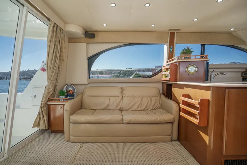 Slide: The Image of Luxurious interior of 2005 Meridian 381 Sedan yacht with leather sofa and nautical decor. - 16