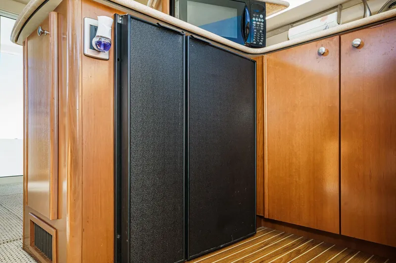 Slide: The Image of 2005 Meridian 381 Sedan interior with wooden cabinetry and built-in appliances. - 23