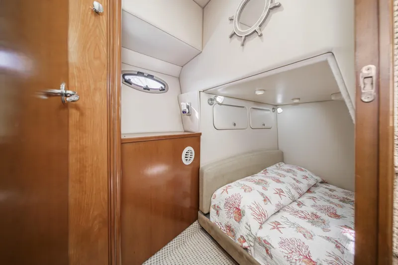 Slide: The Image of 2005 Meridian 381 Sedan cabin interior with cozy bed and nautical decor. - 26