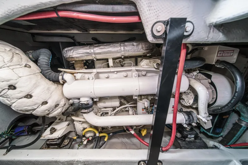 Slide: The Image of Engine compartment of a 2005 Meridian 381 Sedan with visible pipes and wiring. - 29