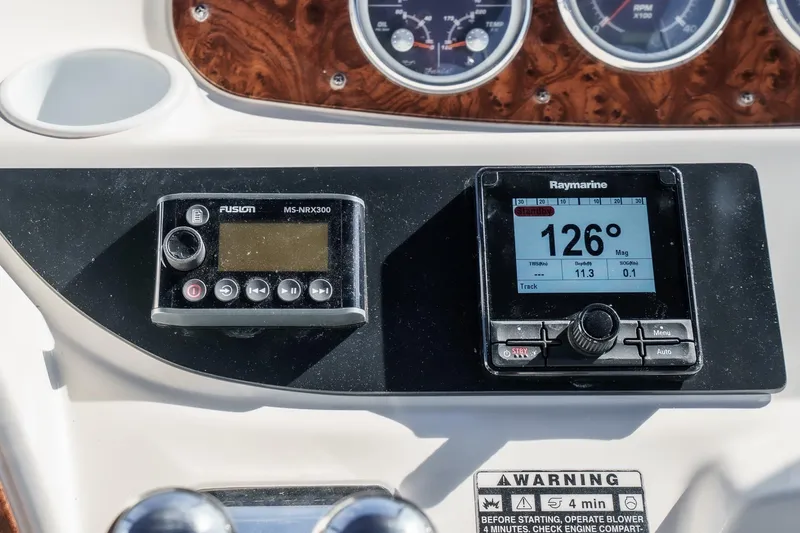 Slide: The Image of Control panel of a 2005 Meridian 381 Sedan with navigation and audio systems. - 8