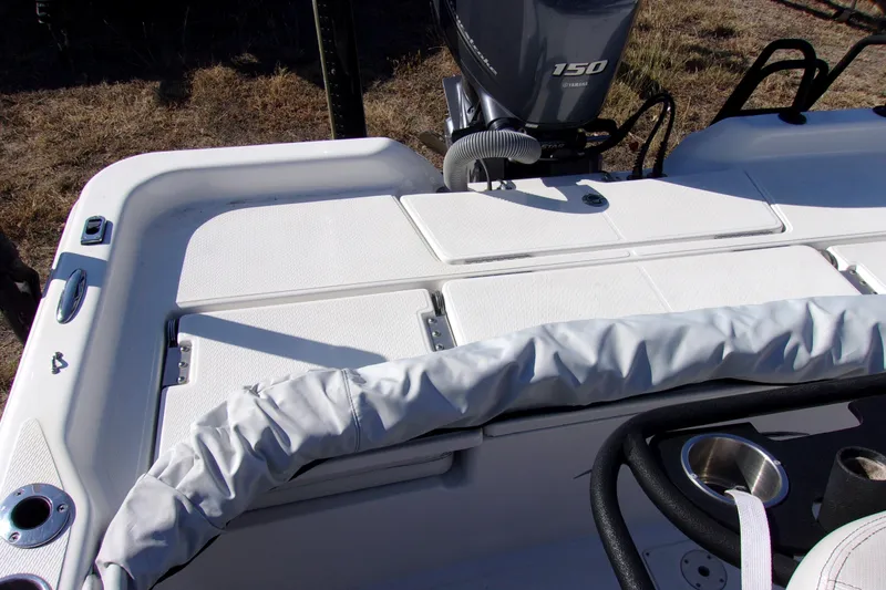 Slide: The Image of 2018 Blue Wave 2200 PureBay boat with Yamaha 150 engine, featuring a clean deck layout. - 7