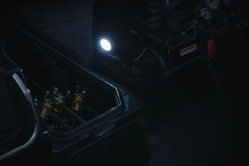 Slide: The Image of 2020 Nitro ZV21 boat storage compartments, featuring a blue interior and black trim. - 13