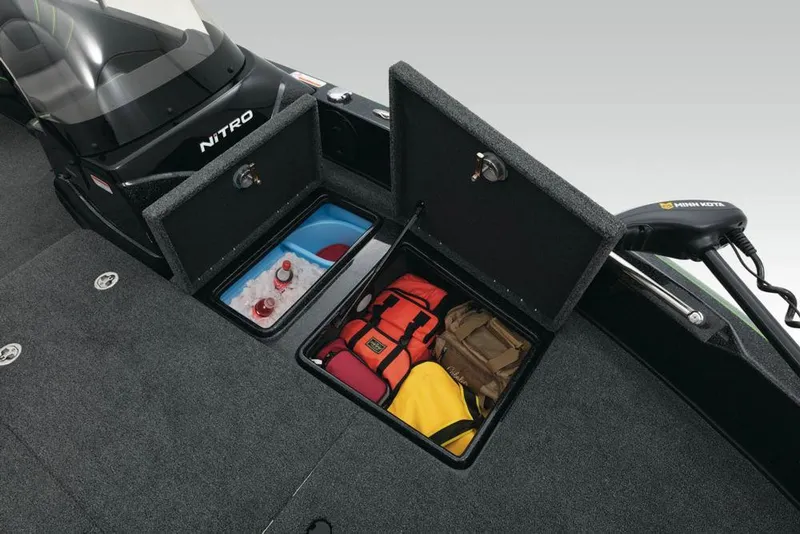 Slide: The Image of 2020 Nitro ZV21 boat interior with trolling motor in a garage setting. - 9