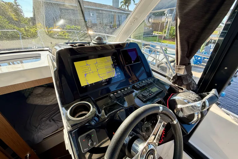 Slide: The Image of Interior view of 2022 Beneteau Antares 9 boat cockpit with navigation system. - 10