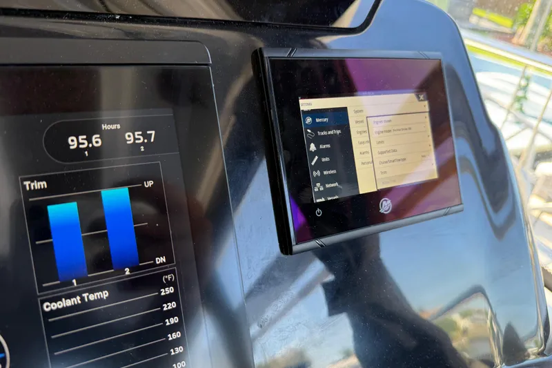 Slide: The Image of Control panel of 2022 Beneteau Antares 9 boat displaying engine data and settings. - 11