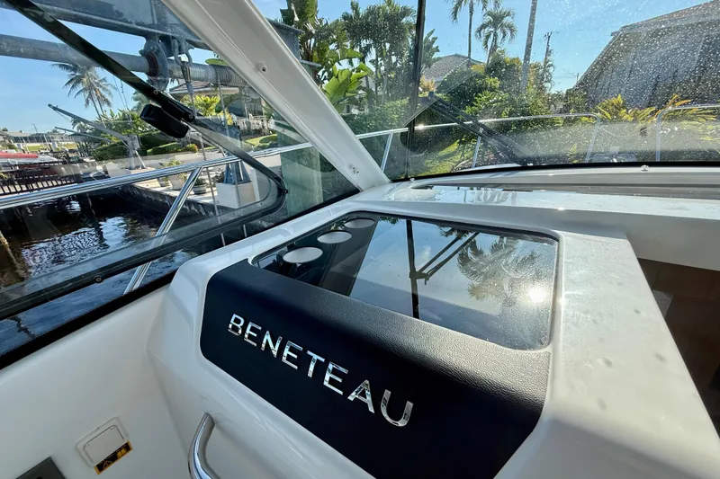 Slide: The Image of Interior view of 2022 Beneteau Antares 9 boat with dashboard and window. - 18