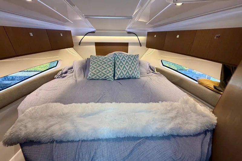 Slide: The Image of Luxurious cabin interior of 2022 Beneteau Antares 9 with cozy bedding and modern design. - 19