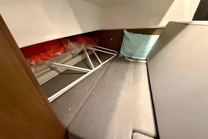 Slide: The Image of Interior cabin of 2022 Beneteau Antares 9 with storage and cushions. - 21