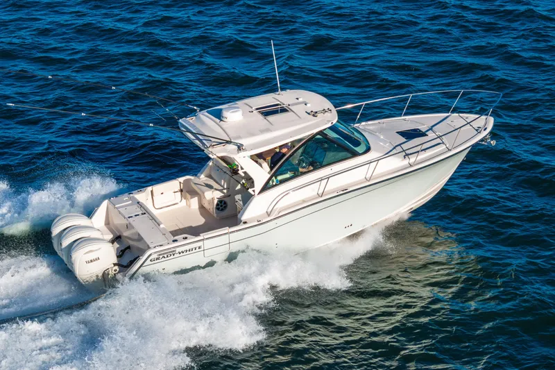 Slide: The Image of 2026 Grady-White Express 340 boat cruising on the ocean. - 2