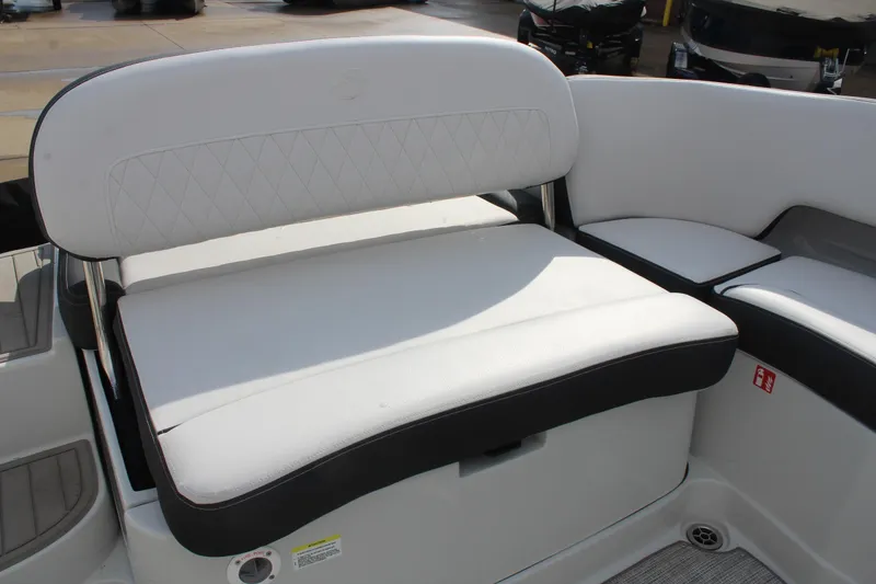 Slide: The Image of 2026 Crownline Eclipse E255 boat seating with white upholstery and diamond stitching. - 13