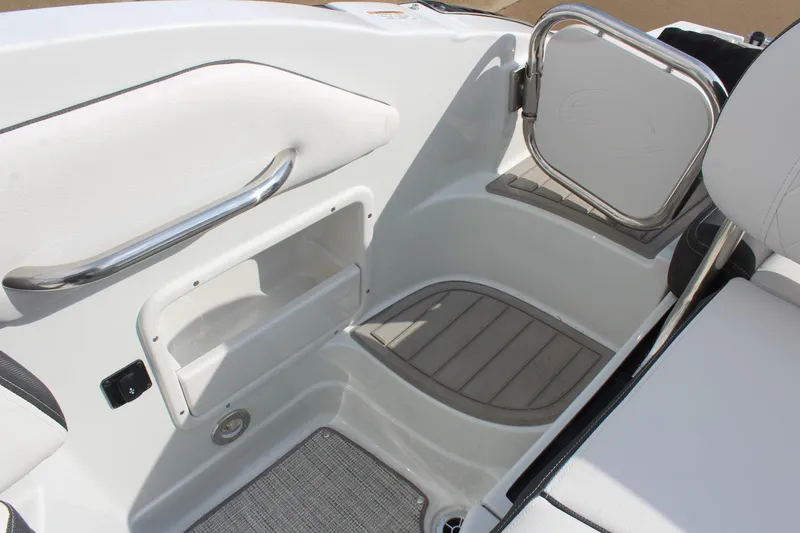 Slide: The Image of 2026 Crownline Eclipse E255 boat interior with white seating and stainless steel accents. - 17