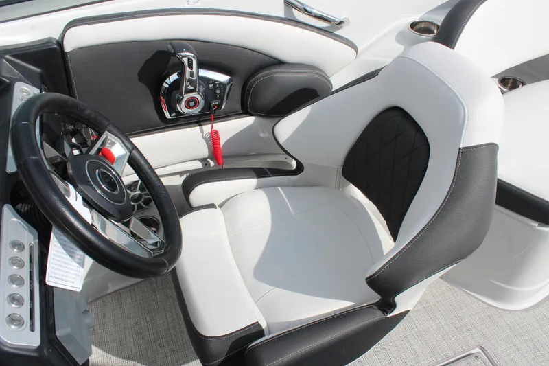 Slide: The Image of 2026 Crownline Eclipse E255 cockpit with modern steering wheel and luxurious seating. - 21