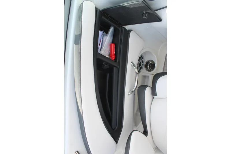 Slide: The Image of Interior of 2026 Crownline Eclipse E255 boat with storage compartment and speaker. - 23