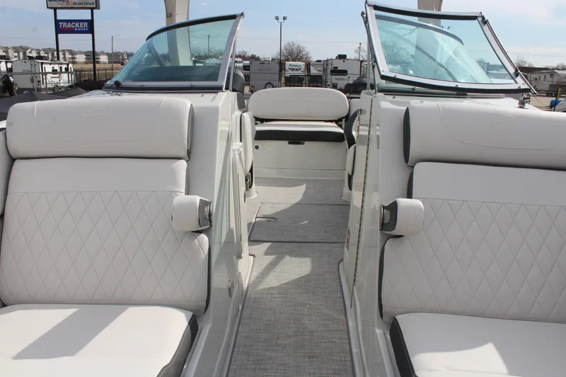 Slide: The Image of 2026 Crownline Eclipse E255 boat interior with white seating and open windshield. - 25