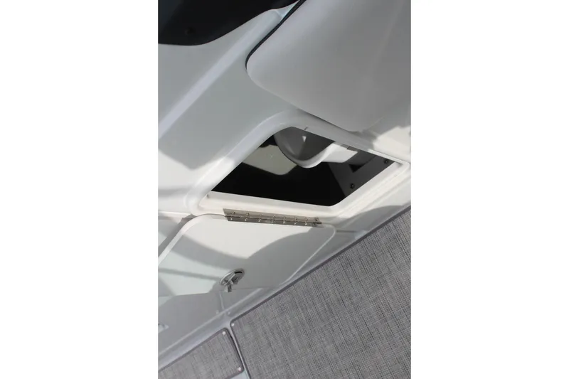 Slide: The Image of Open storage compartment on 2026 Crownline Eclipse E255 boat interior. - 32