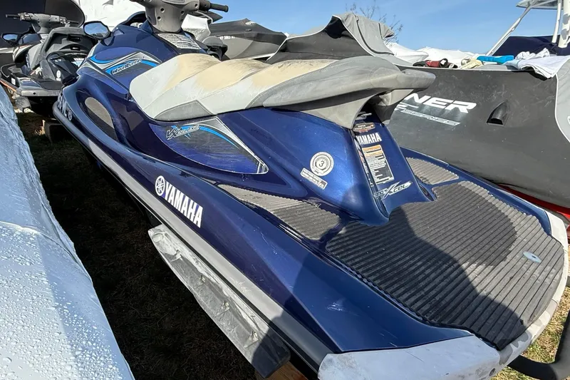Slide: The Image of 2014 Yamaha WaveRunner VX Deluxe, blue, parked outdoors. - 2