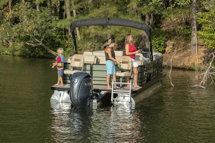 Slide: The Image of 2026 Veranda Fish 22F2 pontoon boat with family fishing on a serene lake. - 6