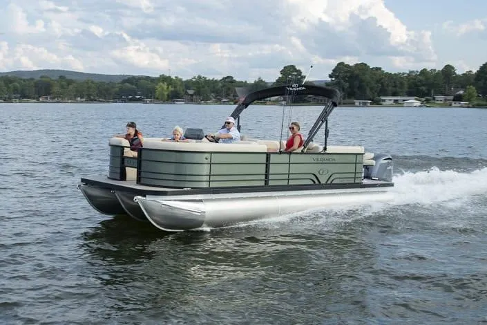 Slide: The Image of 2026 Veranda Fish 22F2 pontoon boat cruising on a scenic lake. - 7