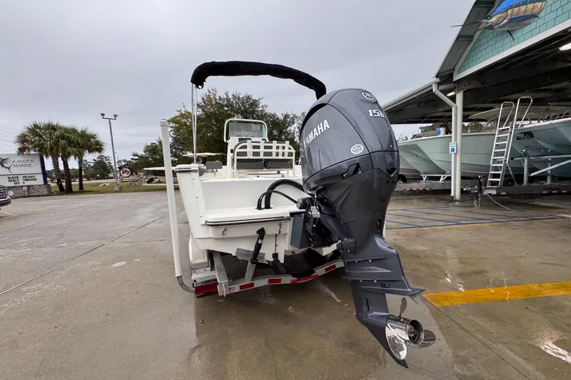 Slide: The Image of 2026 Sea Born LX21 Center Console boat with Yamaha 150 engine at marina. - 13