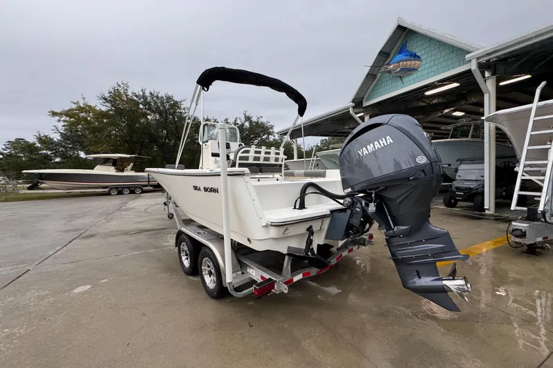 Slide: The Image of 2026 Sea Born LX21 Center Console boat with Yamaha engine on trailer. - 14