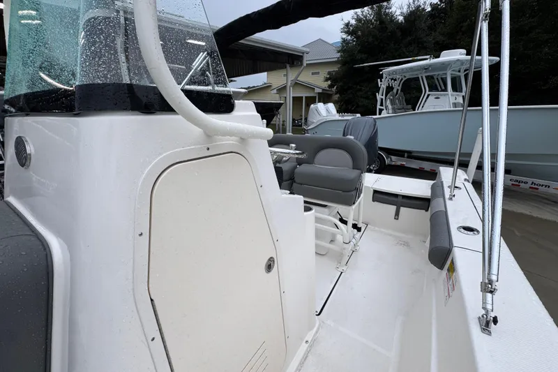 Slide: The Image of 2026 Sea Born LX21 Center Console boat with sleek design and modern features. - 22