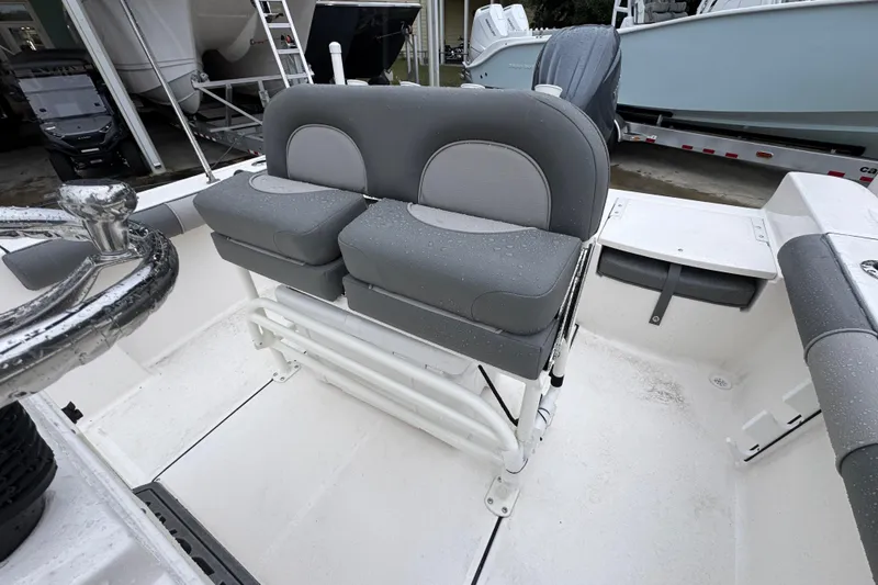 Slide: The Image of 2026 Sea Born LX21 Center Console boat with dual gray seats and wet deck. - 24