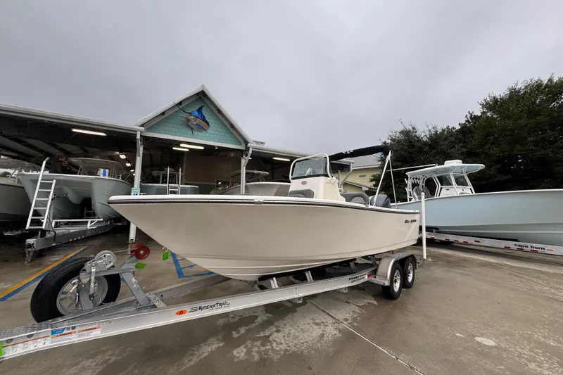 Slide: The Image of 2026 Sea Born LX21 Center Console boat on trailer at dealership. - 3
