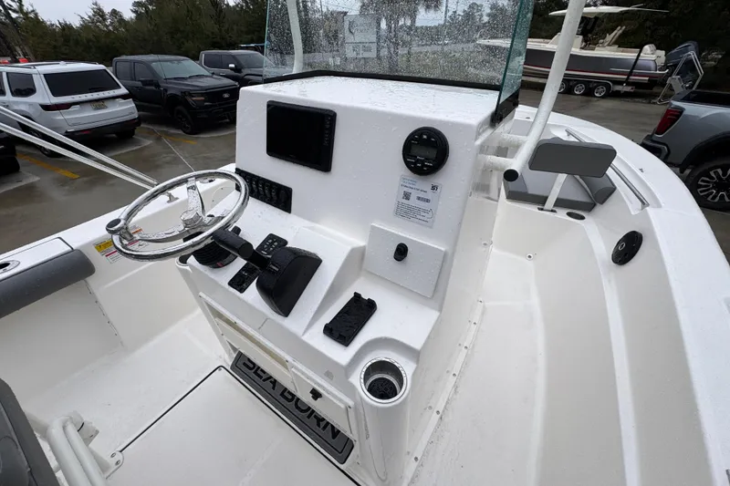 Slide: The Image of 2026 Sea Born LX21 Center Console boat interior with steering wheel and controls. - 30