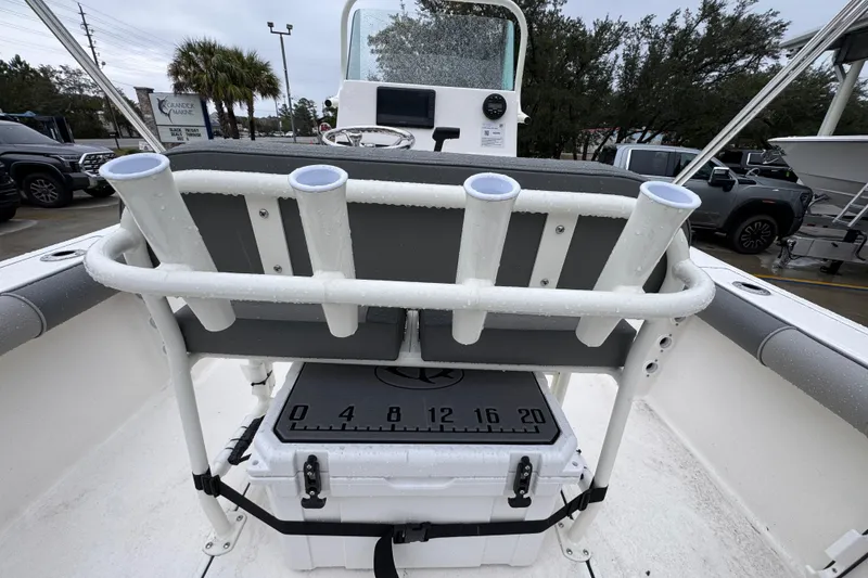 Slide: The Image of 2026 Sea Born LX21 Center Console boat with rod holders and cooler on deck. - 31
