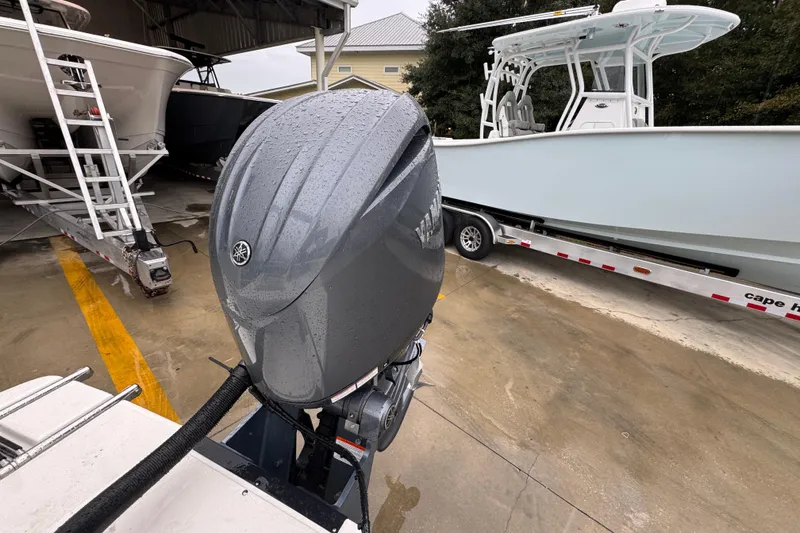 Slide: The Image of 2026 Sea Born LX21 Center Console with Yamaha outboard motor in a boatyard. - 33