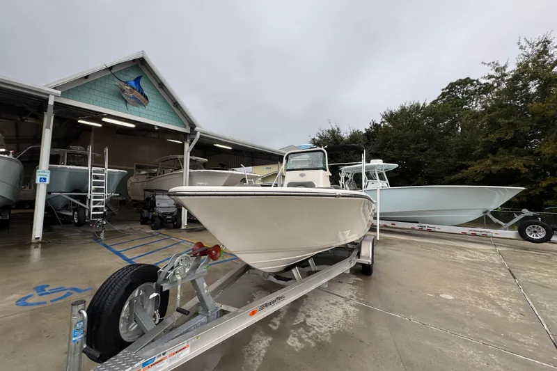 Slide: The Image of 2026 Sea Born LX21 Center Console boat on trailer at dealership. - 4