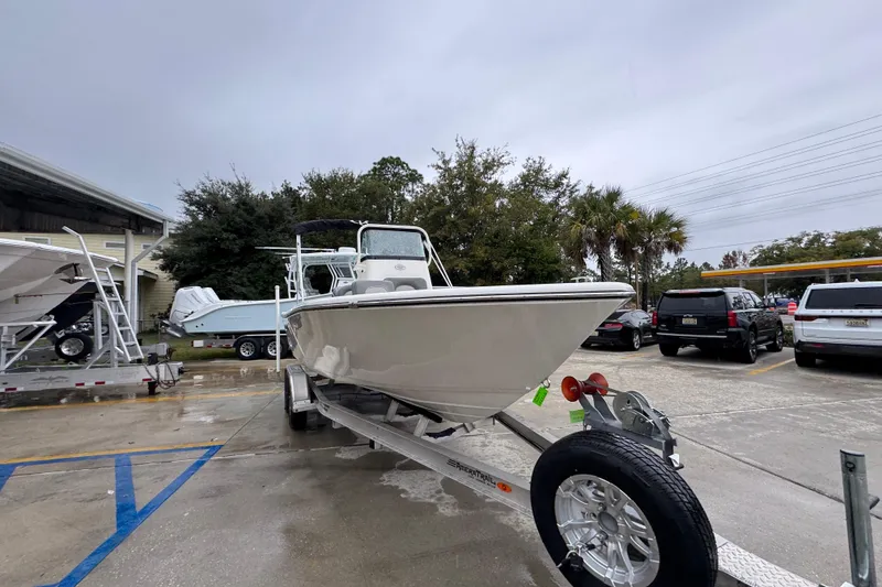 Slide: The Image of 2026 Sea Born LX21 Center Console boat on trailer in parking lot. - 6