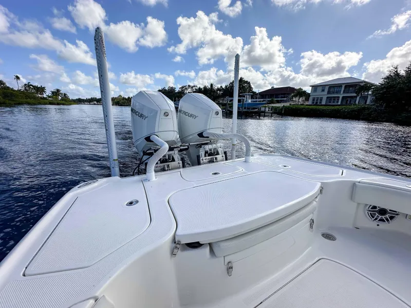 Slide: The Image of 2022 SeaVee 270Z boat with dual Mercury engines on a calm river. - 17