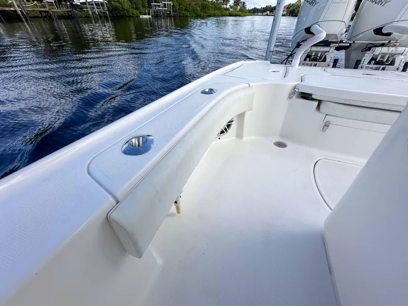 Slide: The Image of 2022 SeaVee 270Z boat deck with sleek white design and water backdrop. - 18