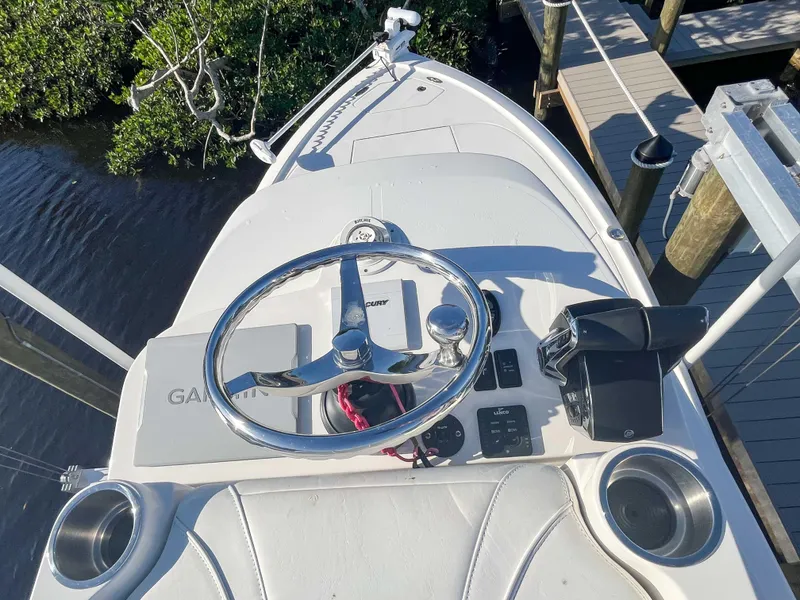 Slide: The Image of 2022 SeaVee 270Z boat helm with Garmin navigation system and steering wheel. - 29