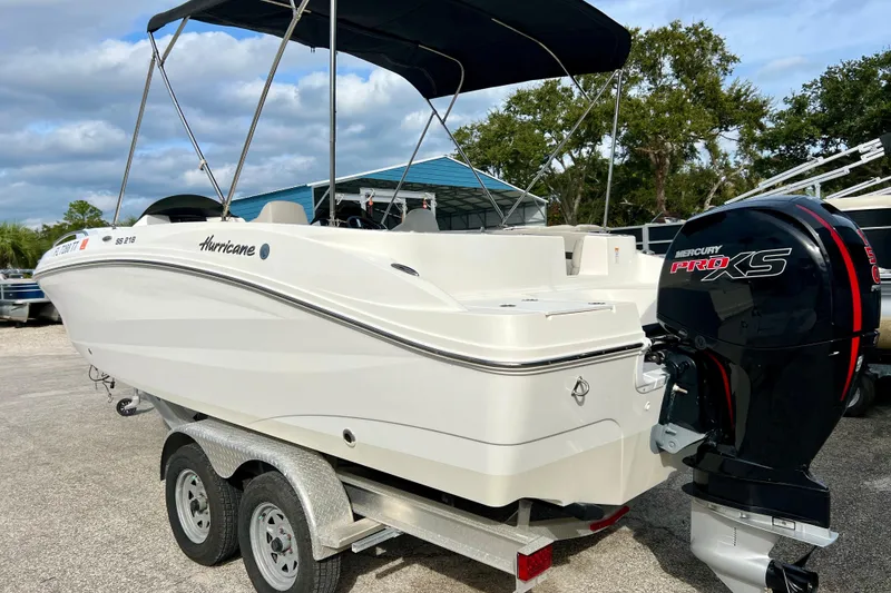 Slide: The Image of 2024 Hurricane Sundeck Sport 218 OB boat with Mercury Pro XS engine on trailer. - 8