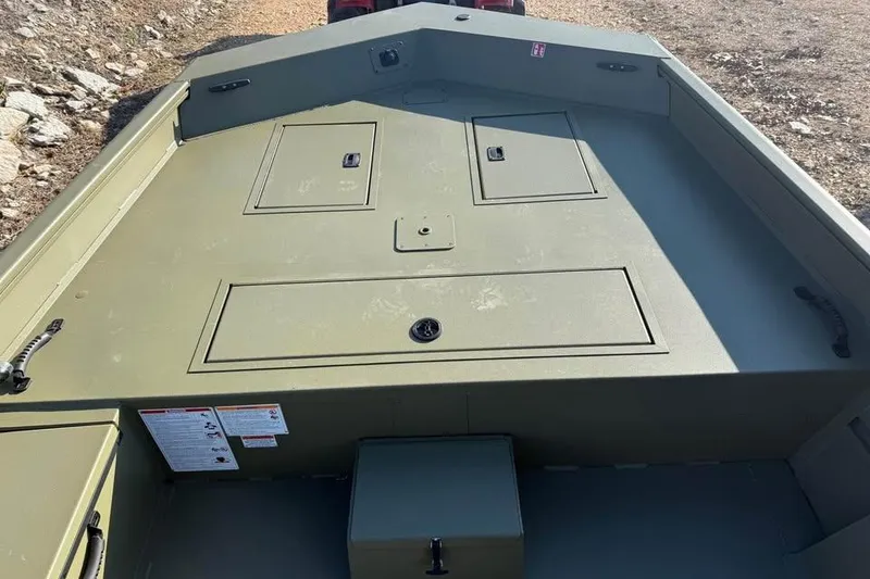 Slide: The Image of 2026 Lowe Roughneck 2070 boat interior with storage compartments, olive green finish. - 12