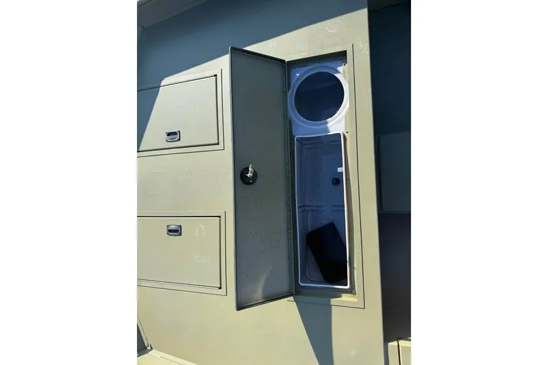 Slide: The Image of Open storage compartment on 2026 Lowe Roughneck 2070 boat, showcasing interior design. - 15