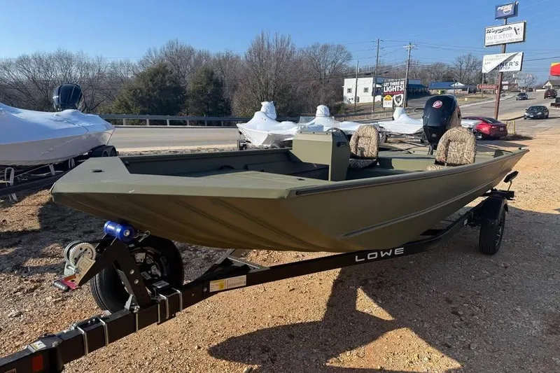 Slide: The Image of 2026 Lowe Roughneck 2070 boat on trailer, parked outdoors, ready for adventure. - 3