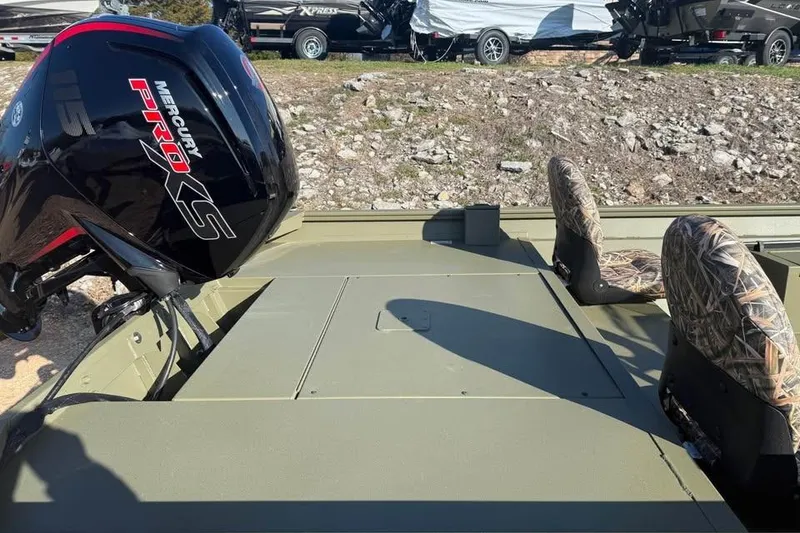 Slide: The Image of 2026 Lowe Roughneck 2070 boat with Mercury Pro XS engine and camo seats. - 7