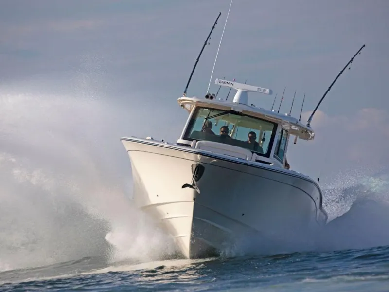 Slide: The Image of 2026 Grady-White Canyon 456 boat navigating rough waters. - 11