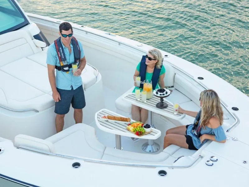 Slide: The Image of People relaxing on a 2026 Grady-White Canyon 456 boat. - 20