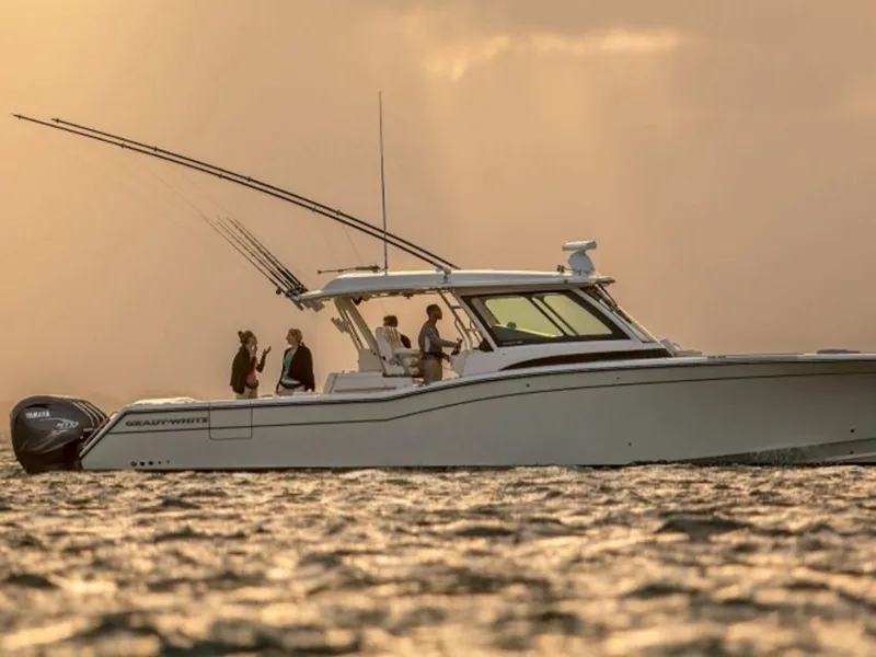 Slide: The Image of 2026 Grady-White Canyon 456 boat on water at sunset. - 28