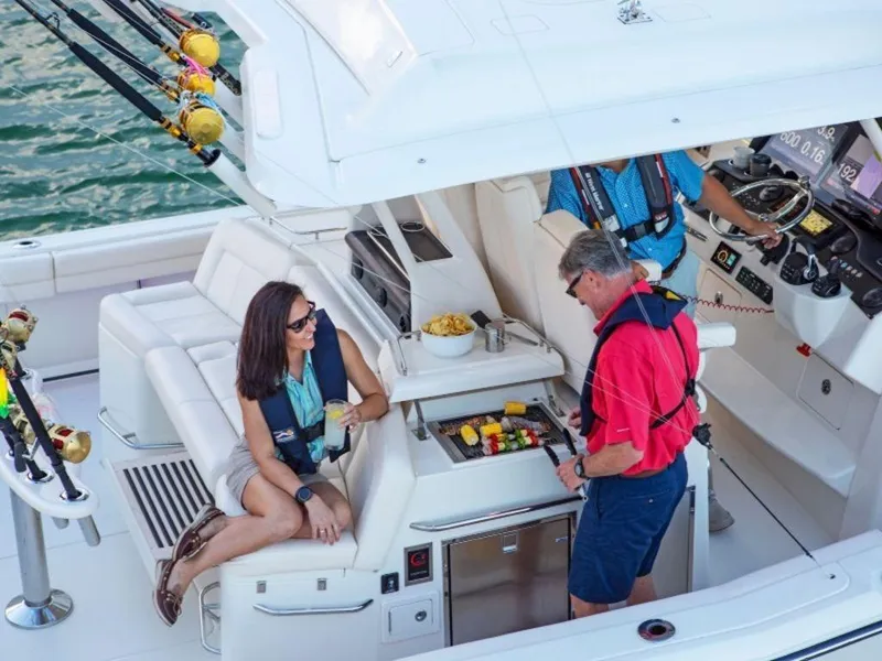 Slide: The Image of People relaxing on a 2026 Grady-White Canyon 456 boat. - 31