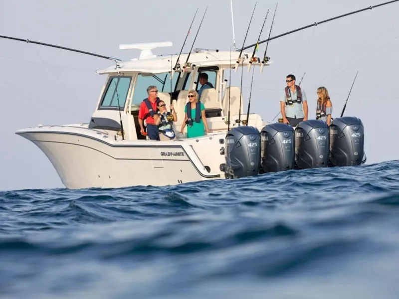 Slide: The Image of 2026 Grady-White Canyon 456 boat with passengers on the sea. - 7